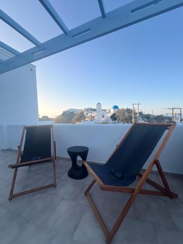 a hammock sitting on top of a roof at Villa Fotini in Firostefani