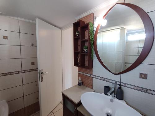 a bathroom with a sink and a mirror at Wave Sound Apartments - Village View in Skala Marion