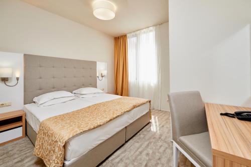 Кровать или кровати в номере Hotel Laguna Park & Aqua Club - All Inclusive