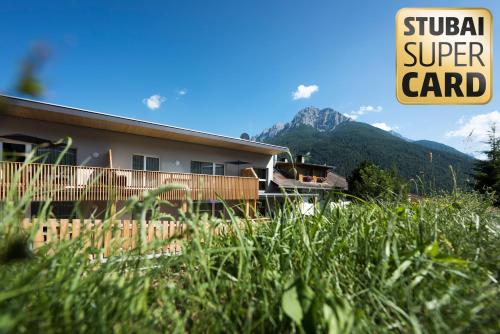 a building with a sign that reads global super card at An der Kaburga in Telfes im Stubai