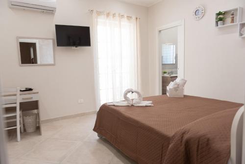 Ένα ή περισσότερα κρεβάτια σε δωμάτιο στο Casa vacanze l'angolo d'oro