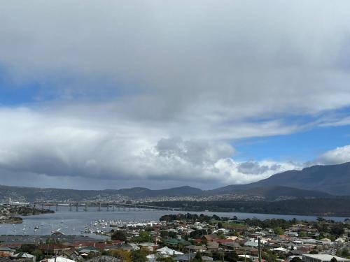 a view of a city and a river with a city at Skyline Serenity House - Close to city and airport in Lindisfarne