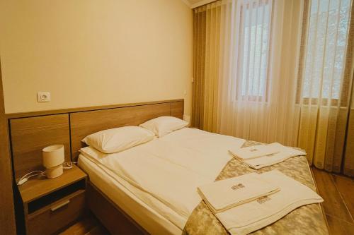 Postel nebo postele na pokoji v ubytování Хижа Марциганица