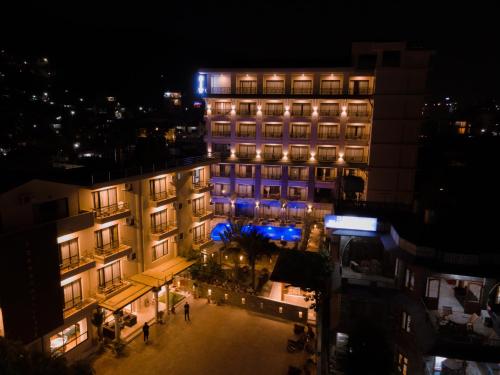 a building with blue lights on it at night at Hotel Pokhara Village & SPA in Pokhara