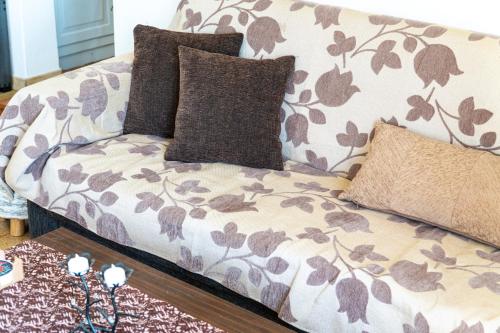 a couch with pillows on it in a living room at Victoria's House in Gaios
