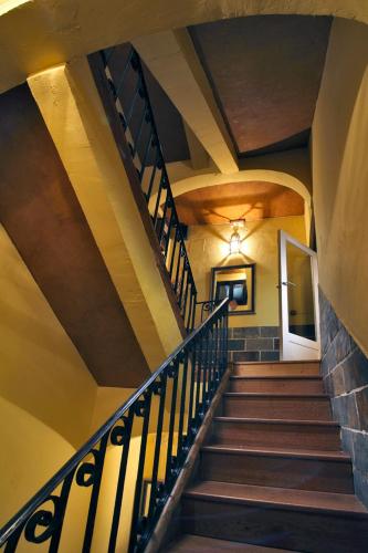 a spiral staircase in a building with a ceiling at Apartamentos El Tiempo in Madrid