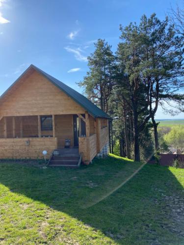 a home with a large yard in front of it at Polana in Lipowiec
