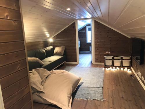 a living room with a couch and a fireplace at Perfect location at Lifjell in Lifjell