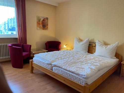 Postel nebo postele na pokoji v ubytování Hotel Ochsen