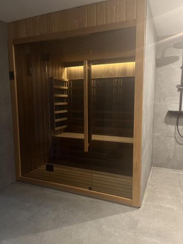 a large glass closet in a room at House DIKA- sauna & jacuzzi in Otočac