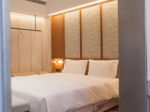 Katil atau katil-katil dalam bilik di Hôtel de Ľeau