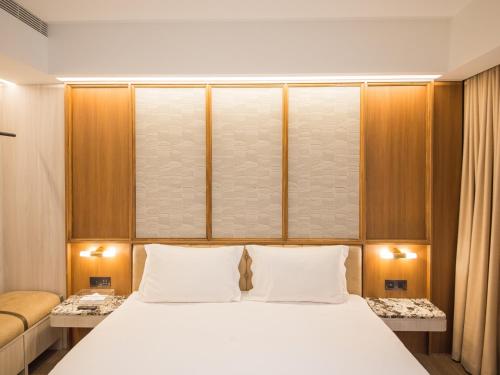 Katil atau katil-katil dalam bilik di Hôtel de Ľeau