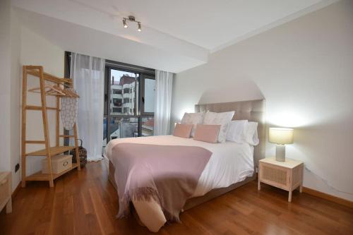 Gulta vai gultas numurā naktsmītnē Apartamento pleno centro de Vigo