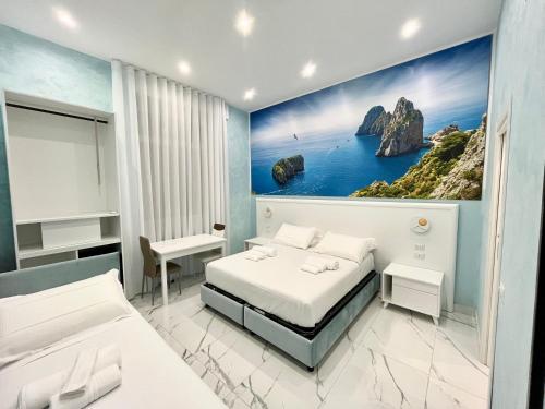 a bedroom with two beds and a painting on the wall at DUOMO MIRADOIS 152 NAPOLI in Naples