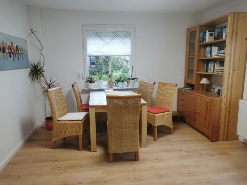 a dining room with a table and chairs at Ferienhaus Marla in Schwebda