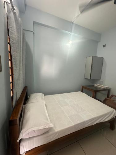 Postel nebo postele na pokoji v ubytování Thaliath Inn Varapuzha