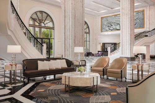 a lobby with a couch and chairs and a table at Nha Trang Marriott Resort & Spa, Hon Tre Island in Nha Trang