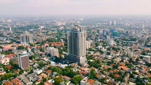 an aerial view of a city with a tall building at The Grand ward place colombo 7 super Luxury 2 bedroom apartment in Colombo