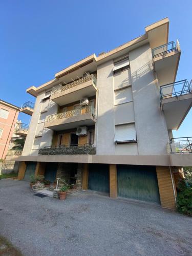 a building with balconies on the side of it at Casa Febo, in centro con parcheggio privato a 200 mt dal mare in Bordighera