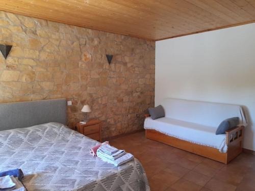 A bed or beds in a room at Quinta do Pomarinho with private pool