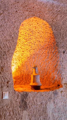 a fire hydrant on the side of a wall at Theodora Village House in Urgup