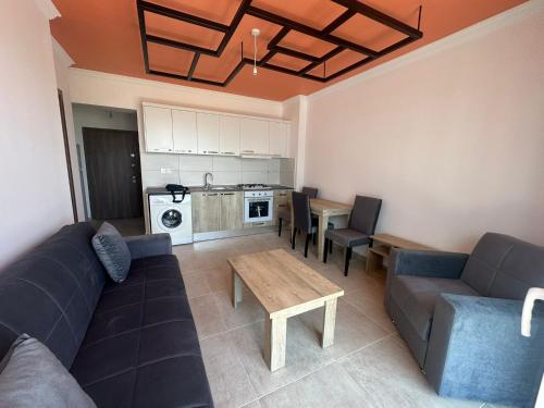 a living room with a couch and a table at View13 in İskele