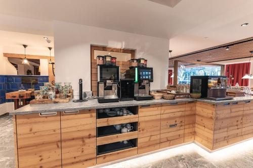 a kitchen with a counter with a coffee maker on it at Der Bären in Zell in Eisenberg