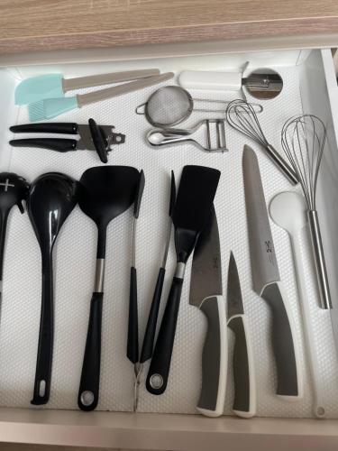 a drawer filled with lots of kitchen utensils at Kerschbaumer.Apartments in Waidhofen an der Ybbs