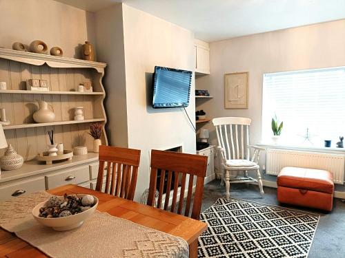 a kitchen with a table and chairs and a dining room at Charming Terrace Home in Whitchurch in Whitchurch