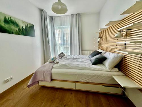 Posteľ alebo postele v izbe v ubytovaní Apartament Caroline Q4Apartments
