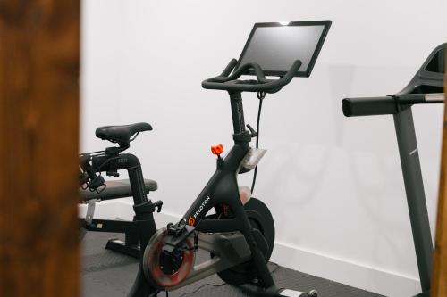 an exercise bike in a room with a treadmill at The Chandler Hotel in Madison
