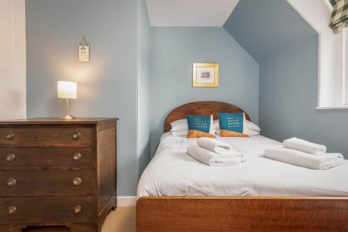 a bedroom with a bed with towels on it at Stables Loft - Elie in Elie