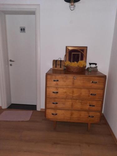 a dresser with a microwave on top of it at Bujtina Lugina e vjosës in Përmet