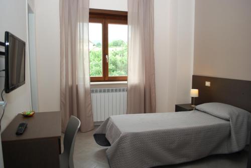 A bed or beds in a room at B&B Grandangolo