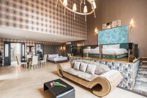 a living room with a couch and a bed at Penthouse Suite Rome - Private Suites in Rome
