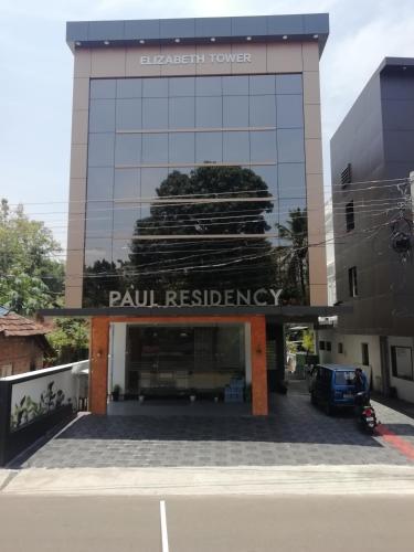 a building with a sign on the front of it at PAUL RESIDENCY in Nedumbassery