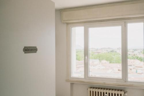 a window in a room with a view of a building at M14 SkyView City Center in Padova