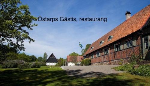 a brick building with a flag on top of it at Karupsvägen 47-23, Blentarp in Blentarp