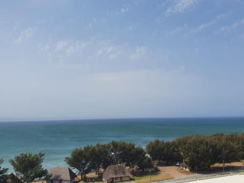 a view of the ocean from the balcony of a house at Nautica in Mossel Bay
