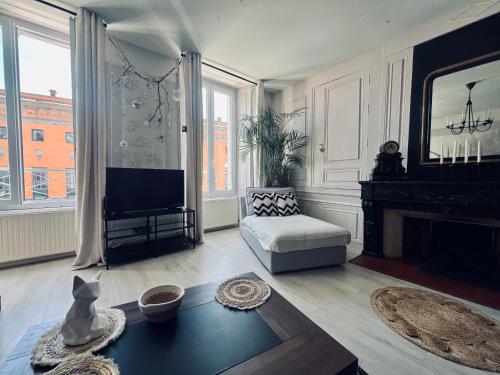 Posezení v ubytování L'Haussmanien au Coeur de ville