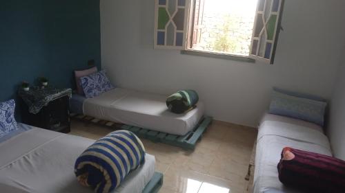 Una cama o camas en una habitación de Villa Rabia