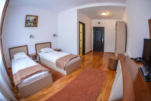 Un pat sau paturi într-o cameră la Hotel Posada