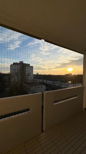 a view of the sunset from a balcony of a building at Luxus-Flat Wohnung-Hanau/Frankfurt in Hanau am Main