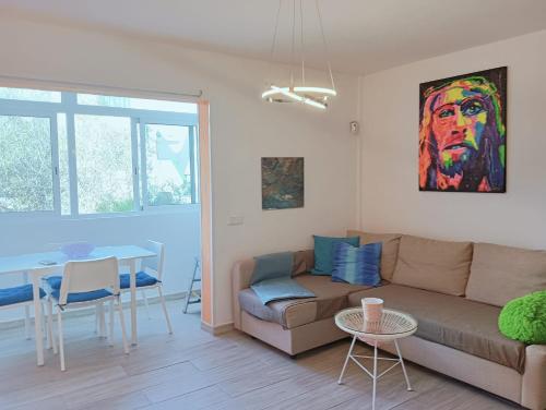 a living room with a couch and a table at FUERTE CAMPILLOS in Costa de Antigua