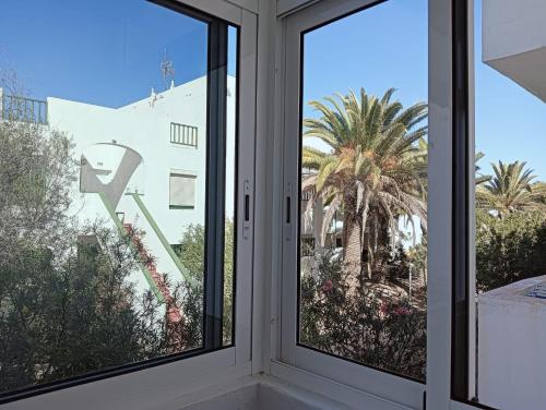 a window with a view of a building at FUERTE CAMPILLOS in Costa de Antigua