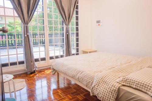 Katil atau katil-katil dalam bilik di Quint Homestay Penampang