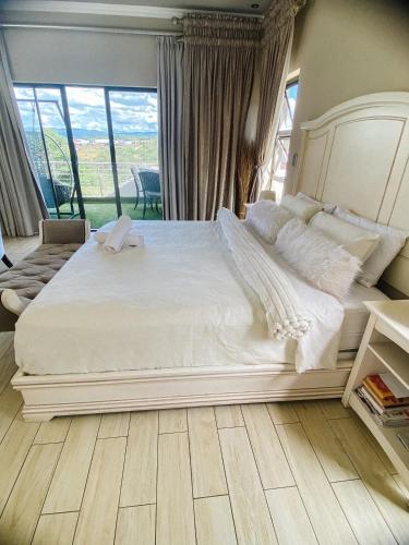 Ένα ή περισσότερα κρεβάτια σε δωμάτιο στο Riverside Boutique Mbombela