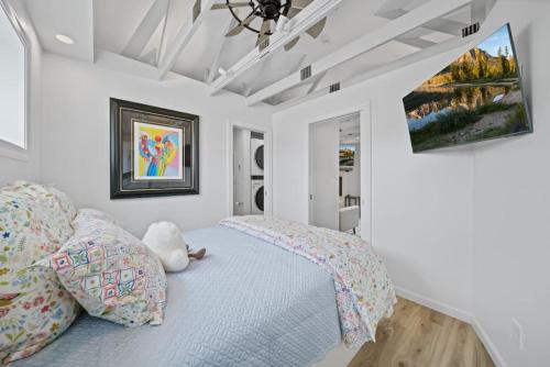 a bedroom with a bed with a stuffed animal on it at Private Cottage on Annie in Coeur d'Alene