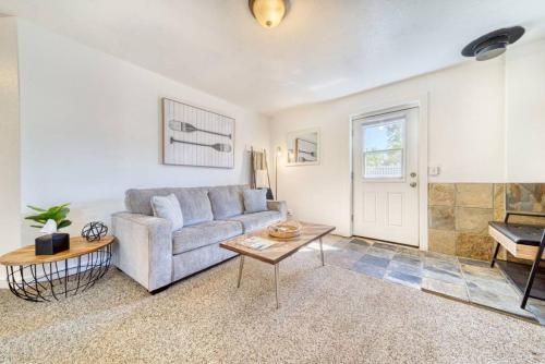 a living room with a couch and a table at CDA Loft, Minutes from Town in Coeur d'Alene