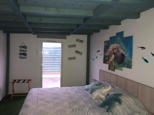 Postel nebo postele na pokoji v ubytování Aruba Local Stay